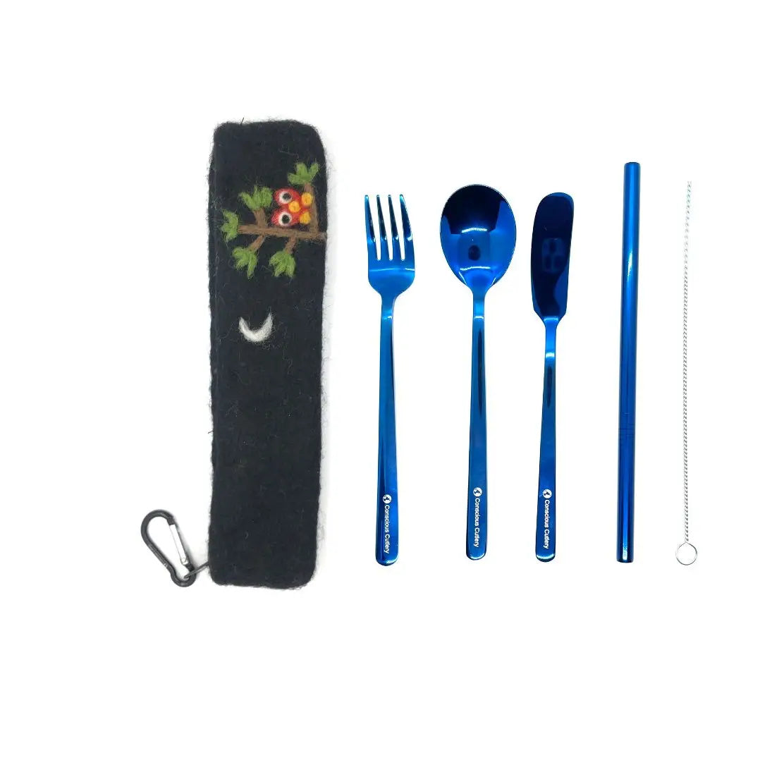 Set of sustainable blue cutlery with a black case featuring an owl design on a white background
